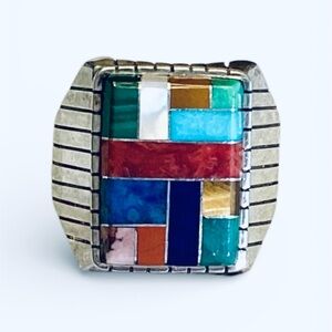 Vintage Navaho silver and 12 multi stone men’s ring handcrafted signed Ray Jack.